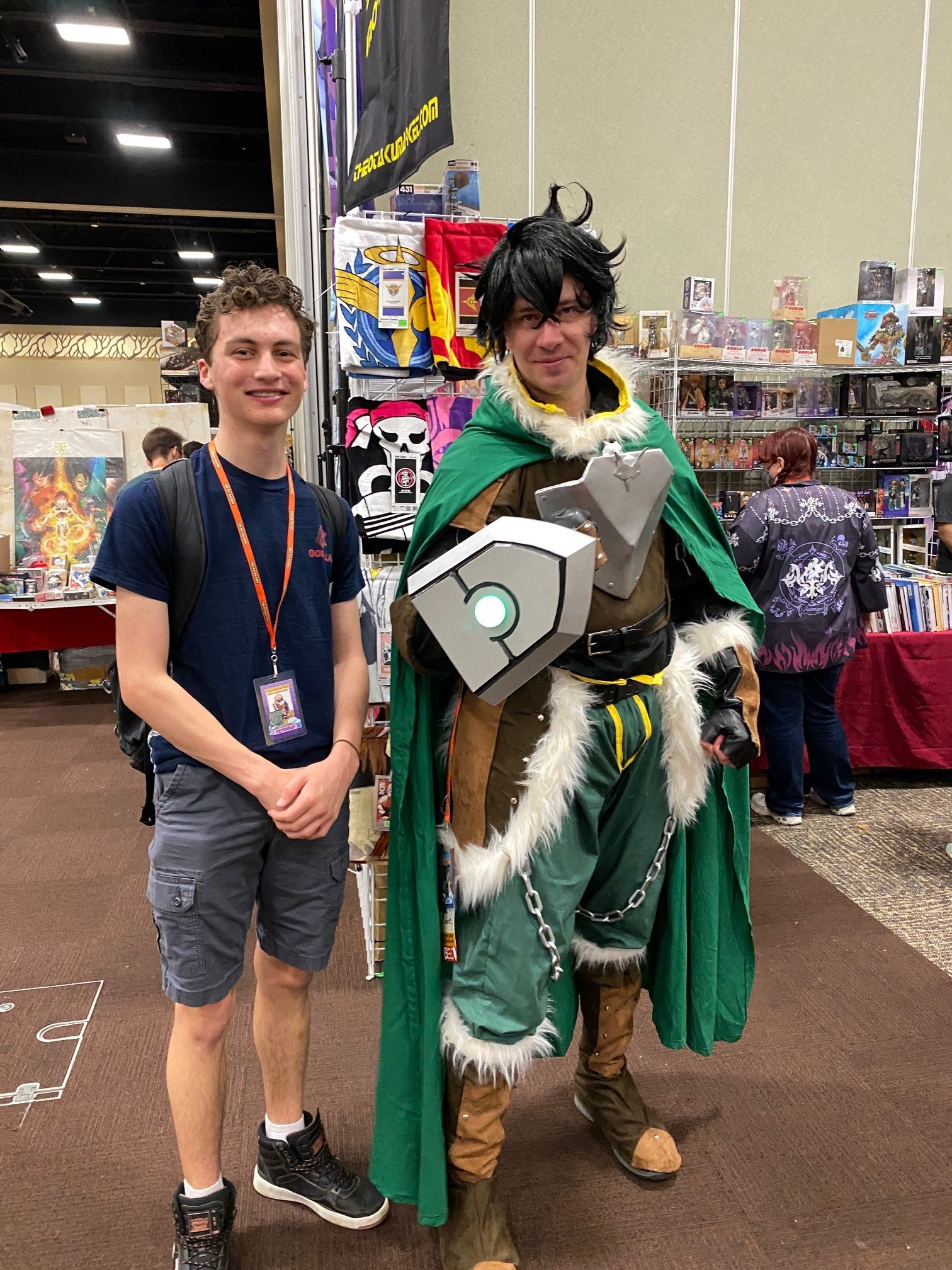My son and a cosplayer dressed as Naofumi Iwatani from the anime The Rising of the Shield Hero..