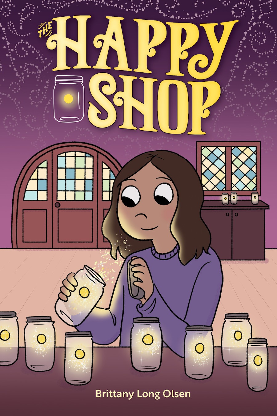 Cover of The Happy Shop, showing a girl standing by a table on which are seven jars with glowing golden spheres inside; she is holding an identical jar, which she has opened, and gold sparkles are flowing toward her face.